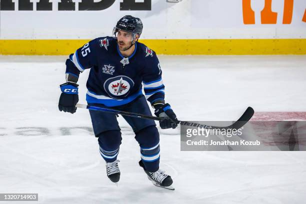 Mathieu Perreault of the Winnipeg Jets keeps an eye on the play during action in the first overtime period against the Edmonton Oilers in Game Four...