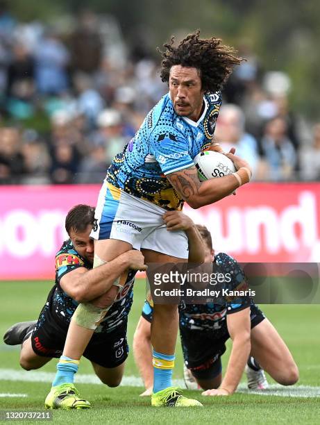 Kevin Proctor of the Titans breaks through the defence during the round 12 NRL match between the Cronulla Sharks and the Gold Coast Titans at C.ex...