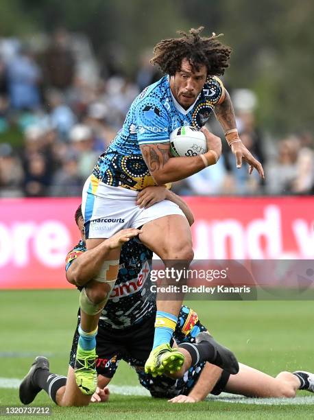 Kevin Proctor of the Titans breaks through the defence during the round 12 NRL match between the Cronulla Sharks and the Gold Coast Titans at C.ex...