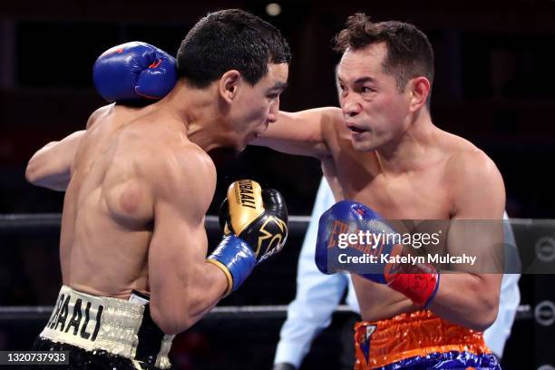 Nonito Donaire punches Nordine Oubaali in the first round during their WBC World Bantamweight Championship bout at Dignity Health Sports Park on May...