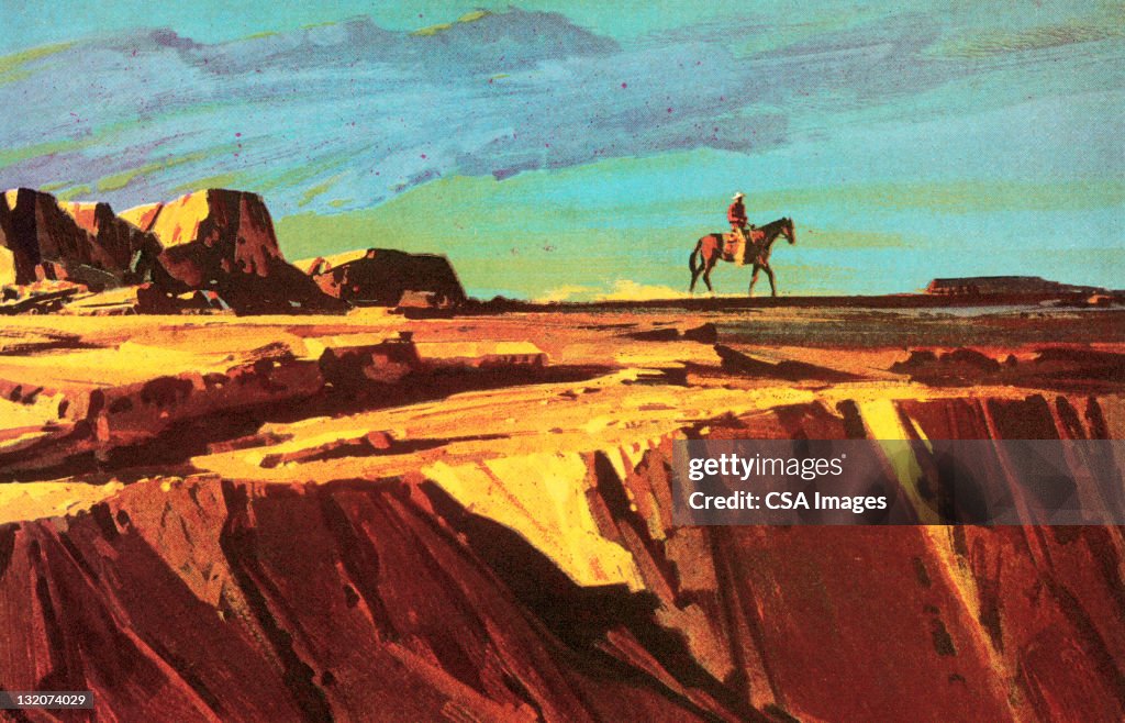 Cowboy e cavallo sulla scogliera