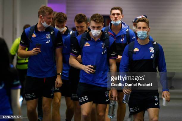 Alex Keath, Jack Macrae , Bailey Dale, Jordon Sweet and Lachie Hunter of the Bulldogs are seen at Melbourne Airport on May 30, 2021 in Melbourne,...