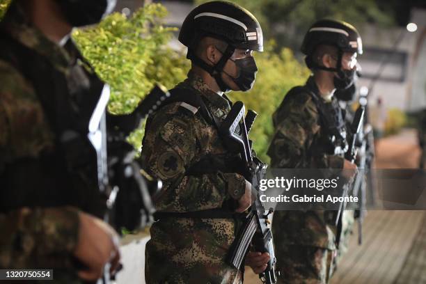 Soldiers stand on patrol outside the "Migual Calero" jockey coliseum a day after protests against the government of Colombian President Iván Duque on...