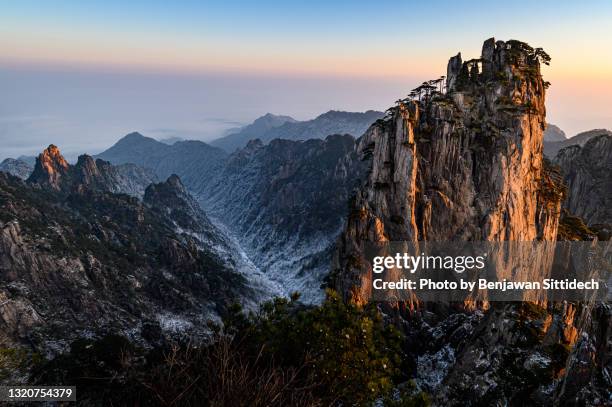 majestic landscape of huangshan (yellow mountain) at sunrise in winter, anhui province, china - huangshan mountain range anhui province china stock pictures, royalty-free photos & images