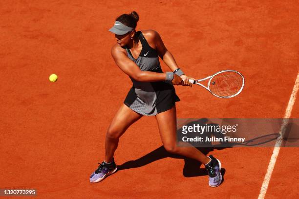 Naomi Osaka of Japan plays a backhand in her First Round match against Patricia Maria Tig of Romania during Day One of the 2021 French Open at Roland...