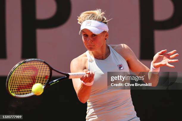 Kateryna Kozlova of Ukraine plays a forehand in her First Round match against Ajla Tomljanovic of Australia during Day One of the 2021 French Open at...