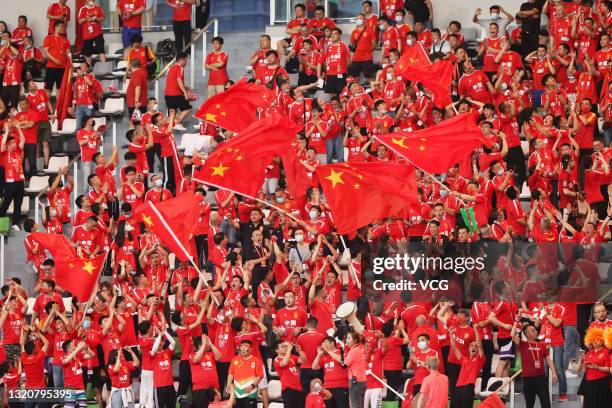 Fans of China cheer during the FIFA World Cup Asian qualifier Group A second round match between China and Guam at Suzhou Olympic Sports Centre...