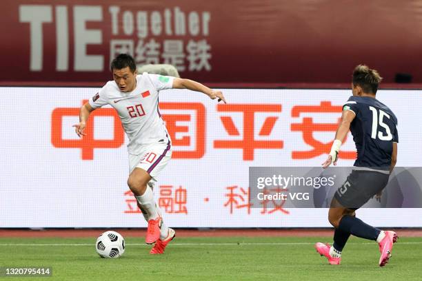 Tang Miao of China drives the ball during the FIFA World Cup Asian qualifier Group A second round match between China and Guam at Suzhou Olympic...