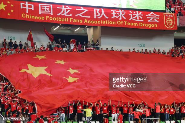 Fans of China cheer during the FIFA World Cup Asian qualifier Group A second round match between China and Guam at Suzhou Olympic Sports Centre...