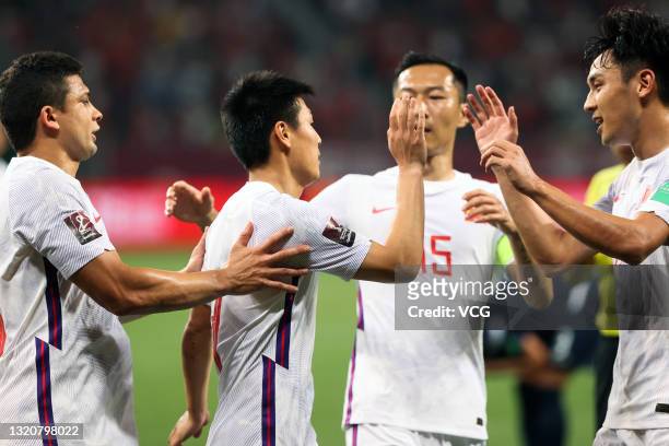 Wu Lei of China celebrates a point with teammates during the FIFA World Cup Asian qualifier Group A second round match between China and Guam at...
