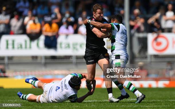 Ollie Devoto of Exeter Chiefs takes on Toby Salmon and George Wacokecoke of Newcastle Falcons during the Gallagher Premiership Rugby match between...