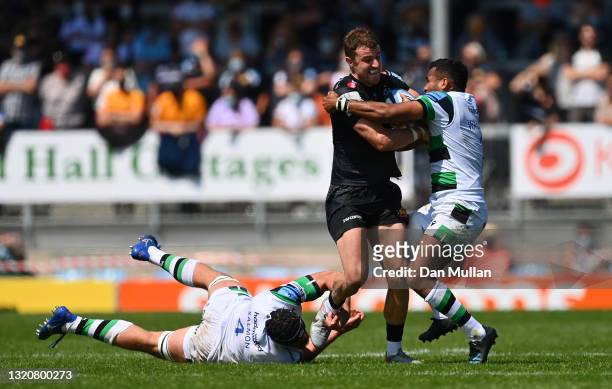 Ollie Devoto of Exeter Chiefs takes on Toby Salmon and George Wacokecoke of Newcastle Falcons during the Gallagher Premiership Rugby match between...