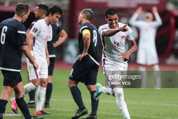Alan Douglas Borges de Carvalho of China celebrates a point during the FIFA World Cup Asian qualifier Group A second round match between China and...
