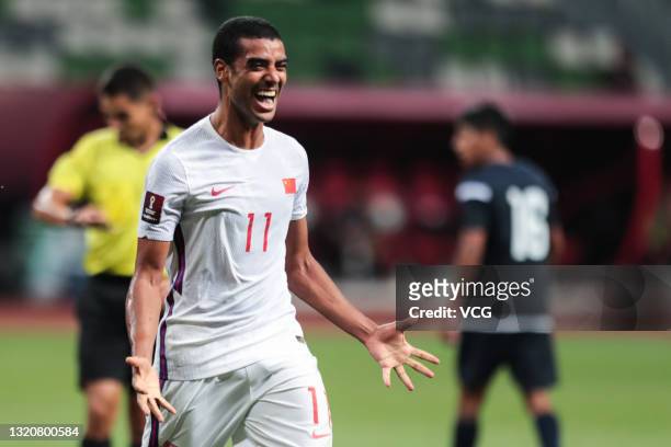 Alan Douglas Borges de Carvalho of China celebrates a point during the FIFA World Cup Asian qualifier Group A second round match between China and...