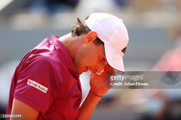 Dominic Thiem of Austria reacts in his First Round match against Pablo Andujar of Spain during Day One of the 2021 French Open at Roland Garros on...