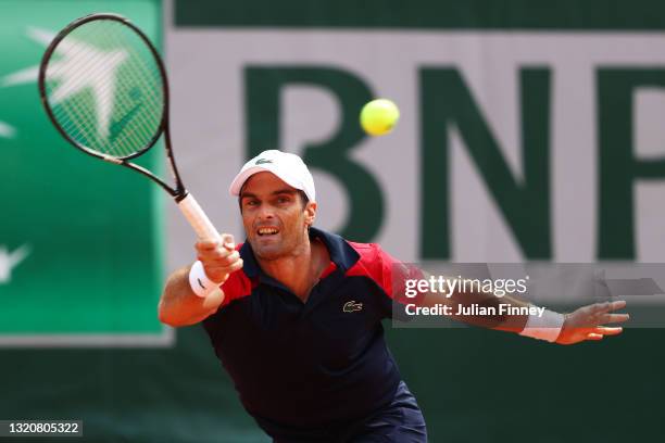 Pablo Andujar of Spain plays a forehand in his First Round match against Dominic Thiem of Austria during Day One of the 2021 French Open at Roland...