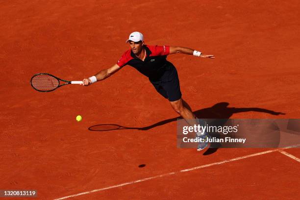 Pablo Andujar of Spain stretches to play a forehand in his First Round match against Dominic Thiem of Austria during Day One of the 2021 French Open...