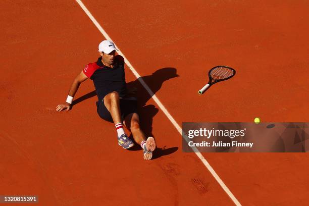 Pablo Andujar of Spain falls over after winning match point in his First Round match against Dominic Thiem of Austria during Day One of the 2021...