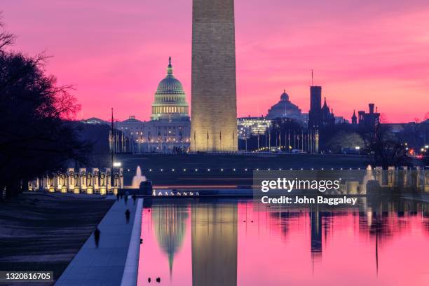 first light at the capitol and washington monument - washington dc imagens e fotografias de stock