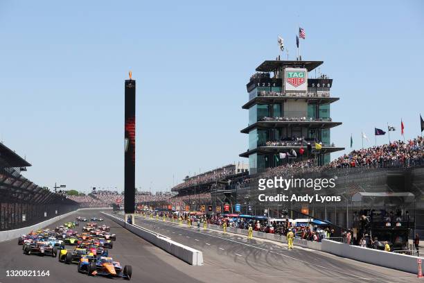 Scott Dixon of New Zealand, driver of the PNC Bank Chip Ganassi Racing Honda, leads the field at the start of the 105th Running Of The NTT IndyCar...