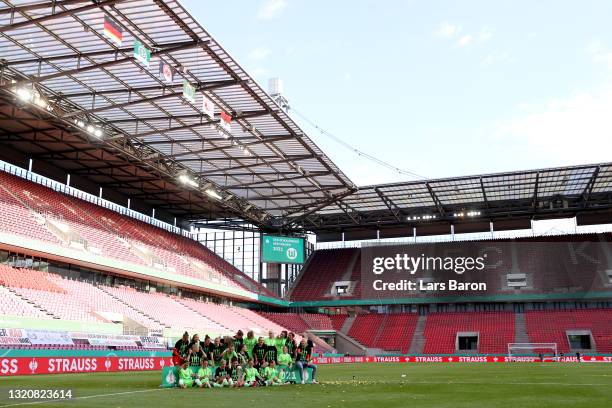 Players of VfL Wolfsburg celebrate with the DFB Cup following victory in the Women's DFB Cup Final match between Eintracht Frankfurt and VfL...