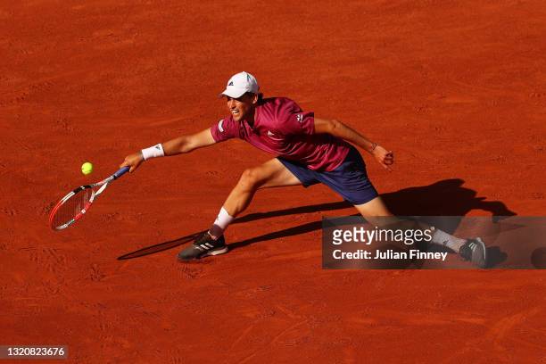 Dominic Thiem of Austria stretches to play a forehand in his First Round match against Pablo Andujar of Spain during Day One of the 2021 French Open...