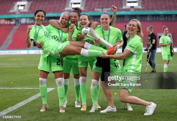 Players of VfL Wolfsburg celebrate with the DFB Cup following victory in the Women's DFB Cup Final match between Eintracht Frankfurt and VfL...