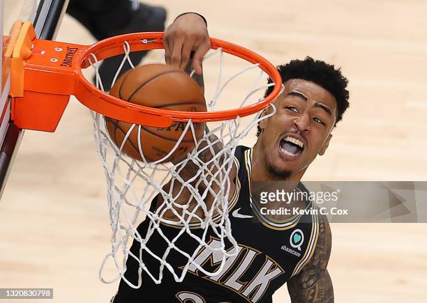 John Collins of the Atlanta Hawks dunks against the New York Knicks in the first half during game four of the Eastern Conference Quarterfinals at...