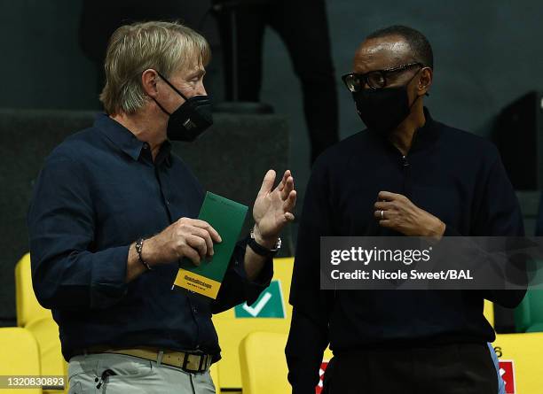 Co-owner Wes Edens of the Milwaukee Bucks, left, talks with president Paul Kagame of Rwanda during the first half of the Basketball Africa League...