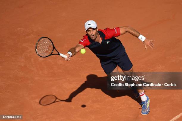 Pablo Andujar of Spain plays a forehand in his First Round match against Dominic Thiem of Austria during Day One of the 2021 French Open at Roland...