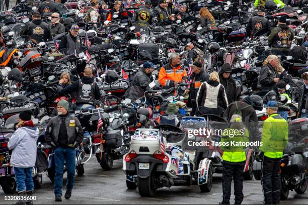 Riders stage at Robert F. Kennedy Memorial Stadium before participating in the "Rolling to Remember" motorcycle rally as they ride past the Lincoln...