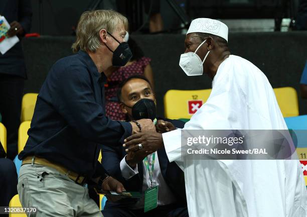 Co-owner Wes Edens of the Milwaukee Bucks, left, talks with president Hamane Niang of FIBA during the first half of the Basketball Africa League...