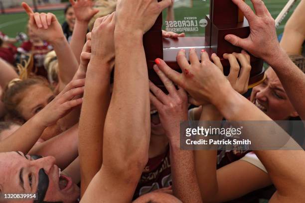 Charlotte North of the Boston College Eagles celebrates with teammates after defeating the Syracuse Orange in the 2021 NCAA Division I Women's...
