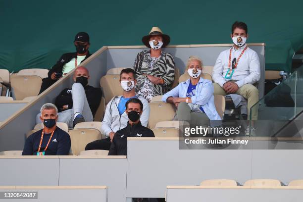 Apostolos Tsitsipas, father of Stefanos Tsitsipas of Greece and Patrick Mouratoglou, coach of Stefanos Tsitsipas look on from his player box in his...
