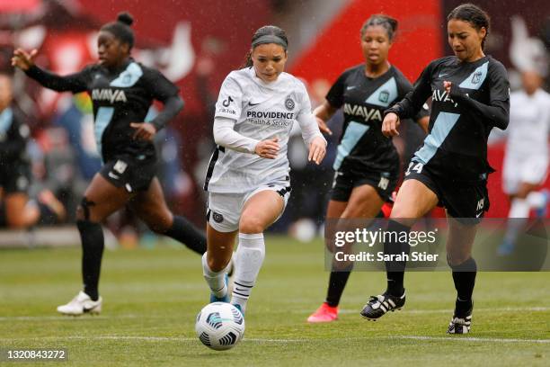 Sophia Smith of Portland Thorns FC dribbles as Estelle Johnson of NJ/NY Gotham FC defends during the first half at Red Bull Arena on May 30, 2021 in...