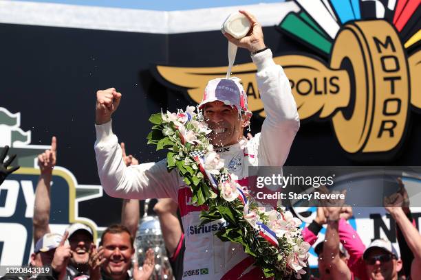 Helio Castroneves of Brazil, driver of the AutoNation/SiriusXM Meyer Shank Racing Honda, celebrates after winning the 105th running of the...