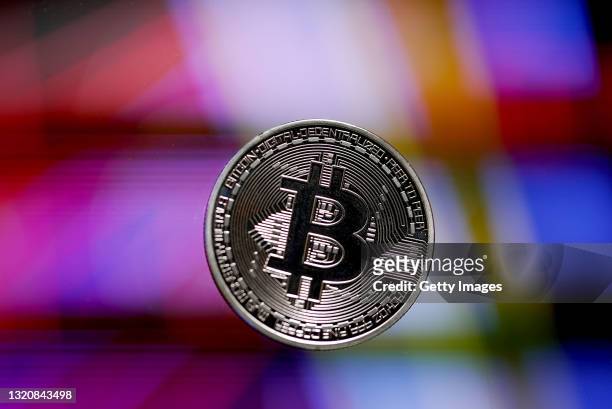 In this photo illustration, a visual representation of Bitcoin cryptocurrency is pictured on May 30, 2021 in London, England. Bitcoin is a...