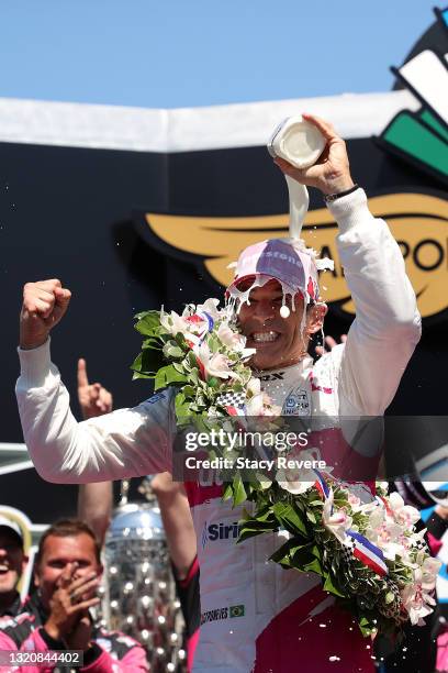 Helio Castroneves of Brazil, driver of the AutoNation/SiriusXM Meyer Shank Racing Honda, celebrates after winning the 105th running of the...