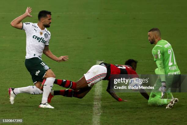 Bruno Henrique of Flamengo fights for the ball with goalkeeper Weverton and Luan of Palmeiras during the match between Flamengo and Palmeiras as part...