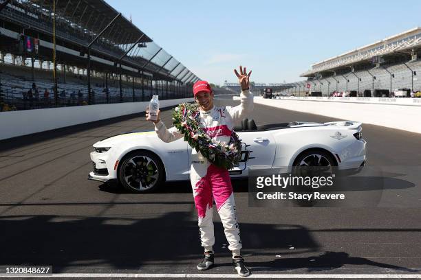 Helio Castroneves of Brazil, driver of the AutoNation/SiriusXM Meyer Shank Racing Honda, celebrates after winning the 105th running of the...