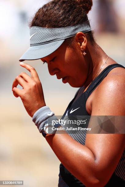 Naomi Osaka of Japan reacts in her First Round match against Patricia Maria Tig of Romania during Day One of the 2021 French Open at Roland Garros on...