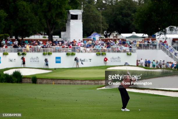 Jason Kokrak hits an approach shot on the ninth hole during the final round of the Charles Schwab Challenge at Colonial Country Club on May 30, 2021...