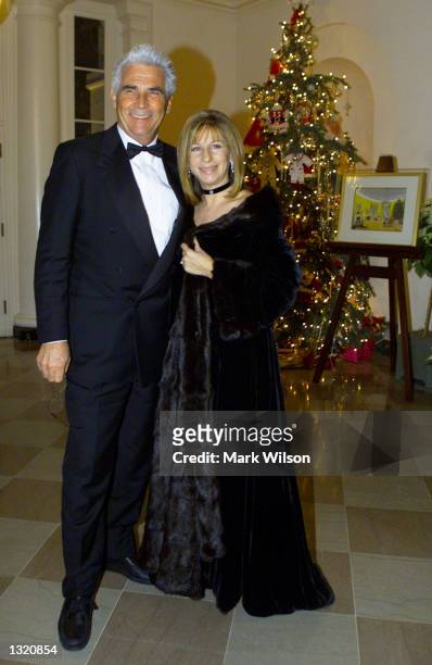 Barbra Streisand and her husband James Brolin arrive at the White House December 20, 2000 in Washington DC. Earlier in the day Streisand recieved a...