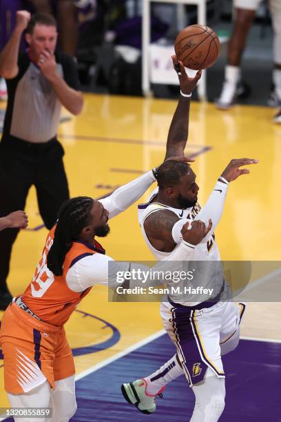 Jae Crowder of the Phoenix Suns fouls LeBron James of the Los Angeles Lakers during the second half of Game Four of the Western Conference...