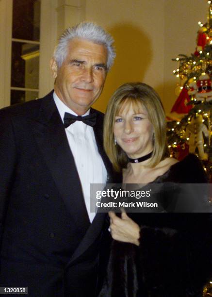 Barbra Streisand and her husband James Brolin arrive at the White House December 20, 2000 in Washington DC. Earlier in the day Streisand received a...