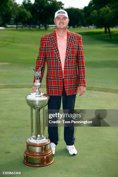 Jason Kokrak celebrates with the Leonard Trophy after winning the 2021 Charles Schwab Challenge at Colonial Country Club on May 30, 2021 in Fort...