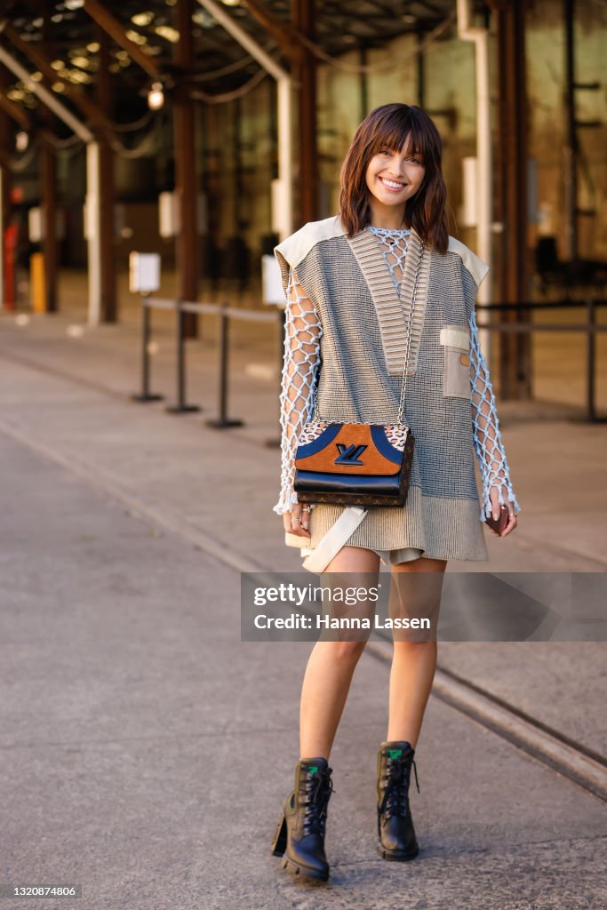 Sarah Ellen wearing Louis Vuitton net top, knit vest, bag and combat  News Photo - Getty Images