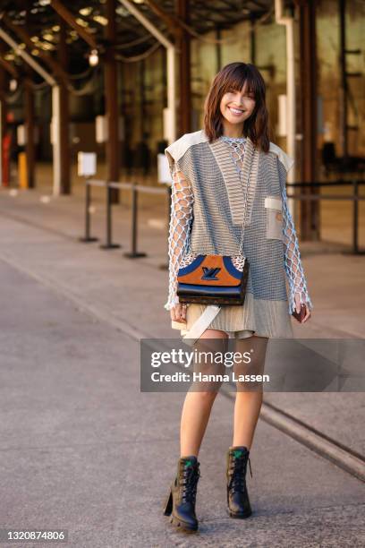 Sarah Ellen wearing Louis Vuitton net top, knit vest, bag and combat boots at Afterpay Australian Fashion Week 2021 on May 31, 2021 in Sydney,...