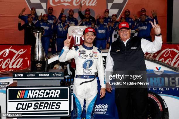 Kyle Larson, driver of the Metro Tech Chevrolet, and NASCAR Hall of Famer and team owner Rick Hendrick celebrate in victory lane after winning, the...