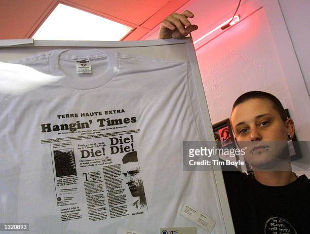 Tattoo artist Adele Rogers displays a t-shirt that promotes the execution of Timothy McVeigh, June 9, 2001at the Body Art Ink tattoo shop in Terre...